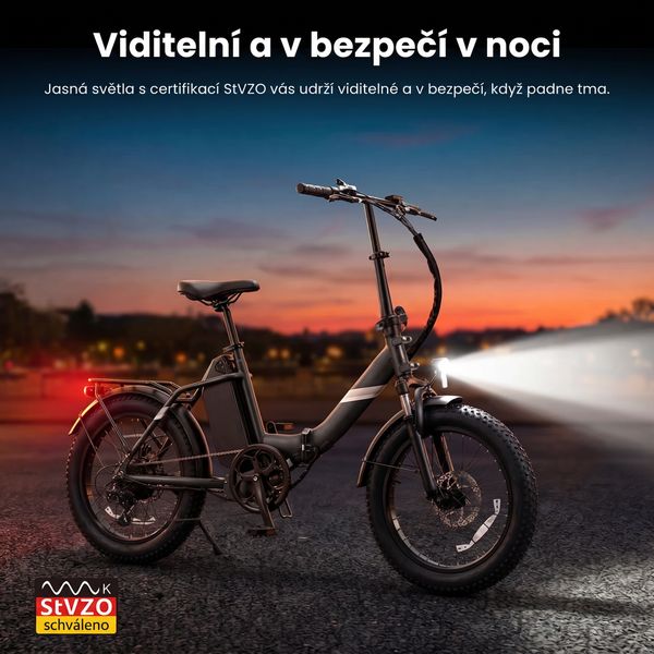 Elektrokolo Touroll S3 se zapnutým předním světlem při západu slunce a označením StVZO